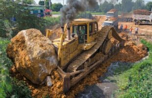 OMG! WATCH AN INCREDIBLE HEAVY EQUIPMENT OPERATION AS A MASSIVE DUMP TRUCK UNLOADS TONS OF ROCKS!
